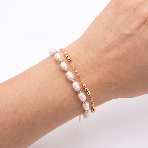 Close-up of the Lelice Adele Pearl Bracelet in gold on the wrist