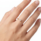 Hand wearing Lelice gold heart crystal solitaire ring Aimée