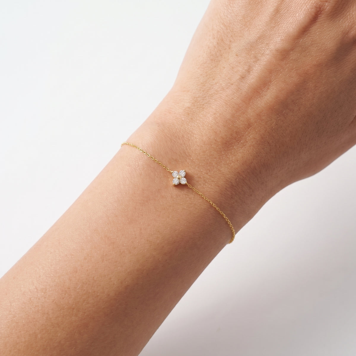 Close-up of the Lelice Alice Clover Bracelet in gold on the wrist