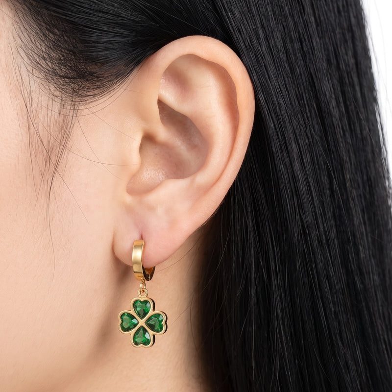 Close-up of the Lelice Alice Clover Earrings in gold on the ear
