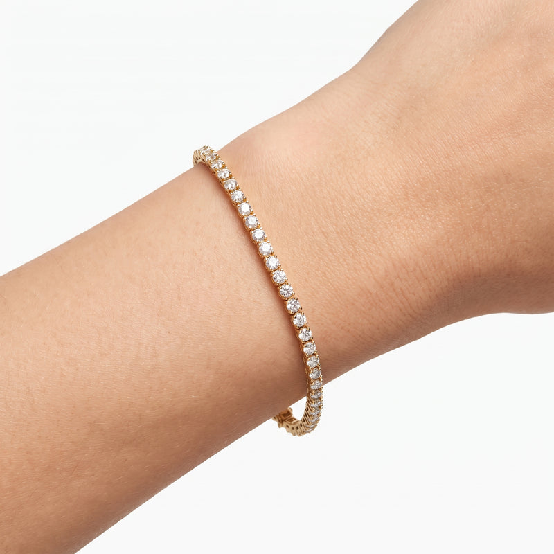 Close-up of the Lelice Alice Tennis Bracelet in gold on the wrist