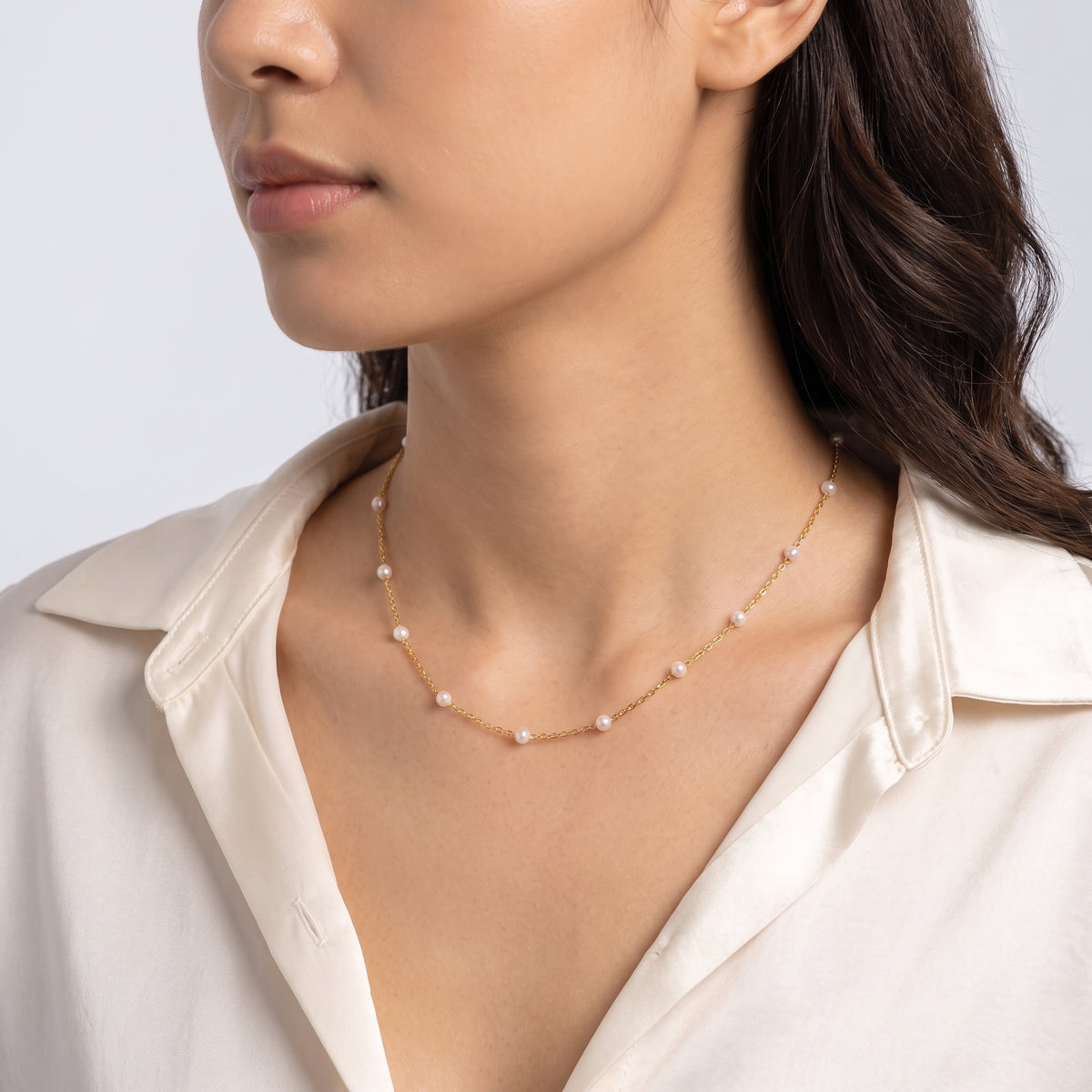 Woman turned three-quarters wearing the Amalfi Pearl Necklace