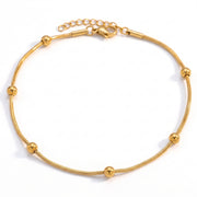 Lelice Amara Beaded Glow Anklet in gold on a white background