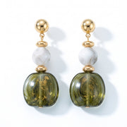 Lelice Amara Green Marbled Acrylic Statement Drop Earrings in gold on a white background