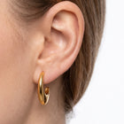Close-up of the Lelice Amber Gold Earrings in gold on the ear