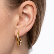 Close-up of the Lelice Amber Gold Earrings in gold on the ear