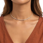 Close-up of the Lelice Amira Crystal Choker in gold at the collarbone