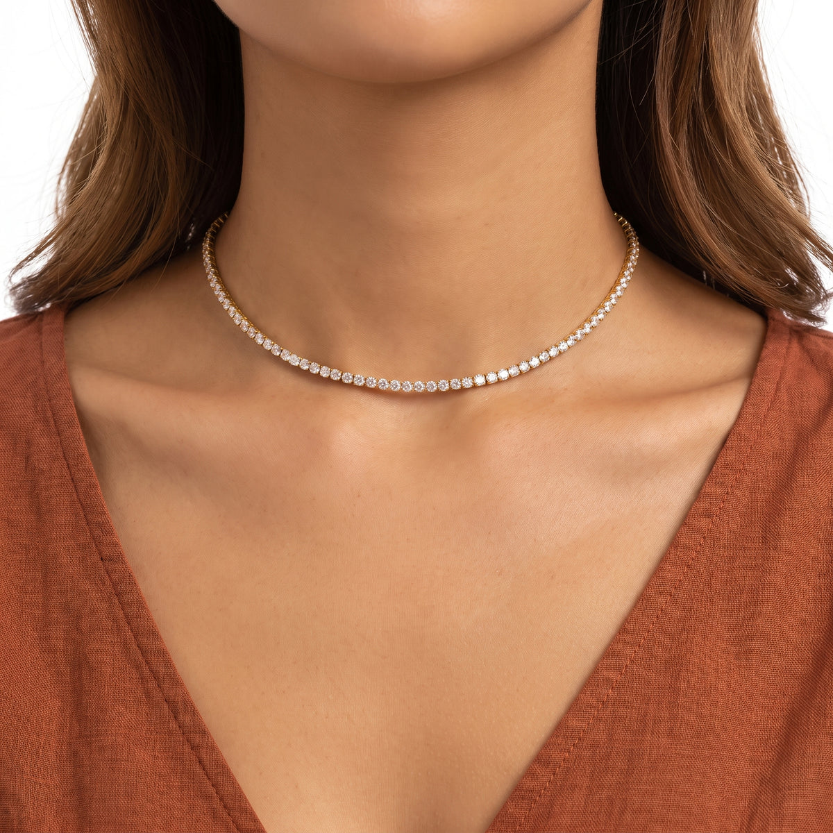 Close-up of the Lelice Amira Crystal Choker in gold at the collarbone