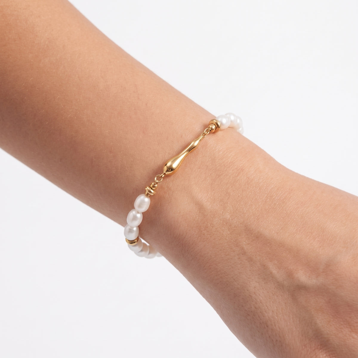 Close-up of the Lelice Ana Pearl Bracelet in gold on the wrist