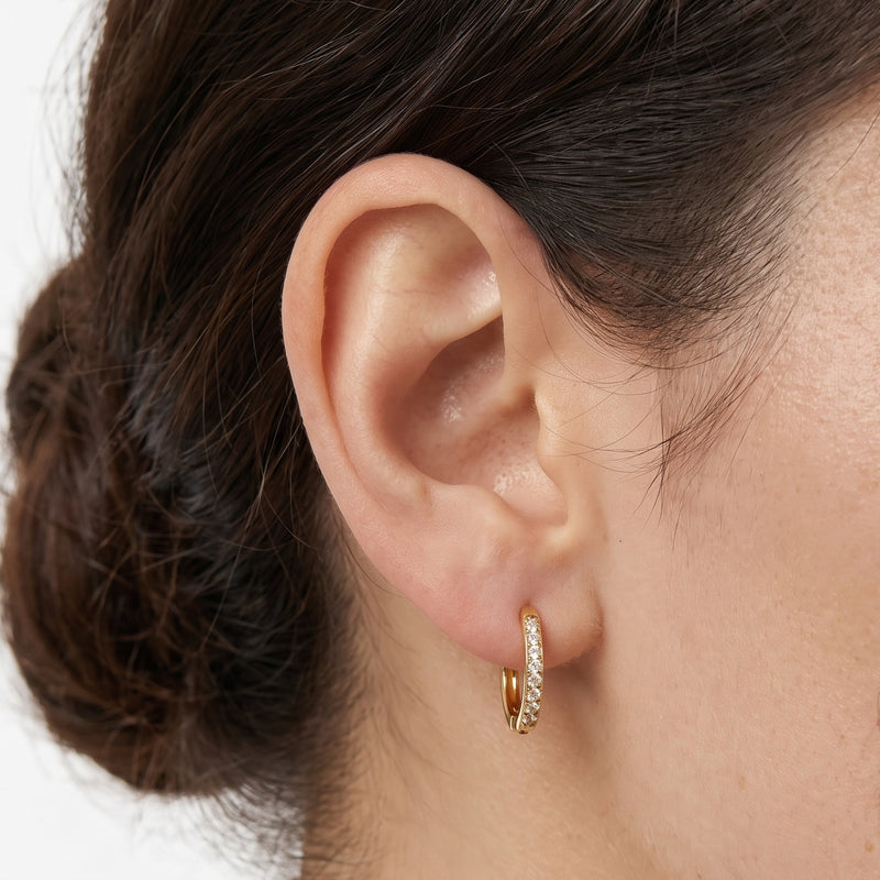 Close-up of the Lelice Anna Circle Hoops in gold on the ear
