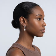 Model wearing the Lelice Artemis Silver Pearl Drops, slicked-back profile