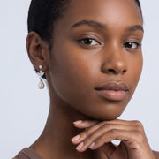 Model wearing the Lelice Artemis Silver Pearl Drops, hand at the chin