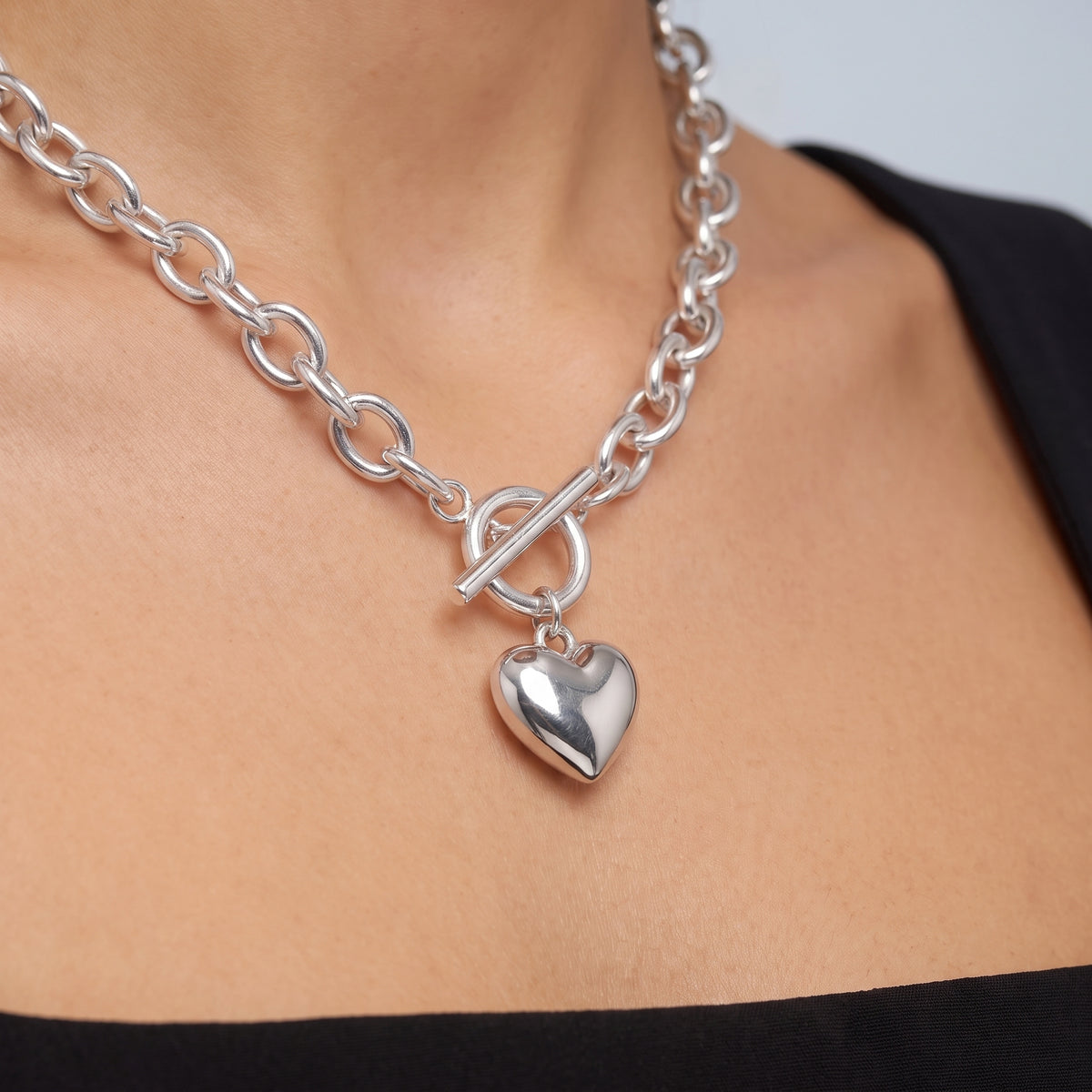Close-up of the Bea Chunky Silver Necklace resting on the skin