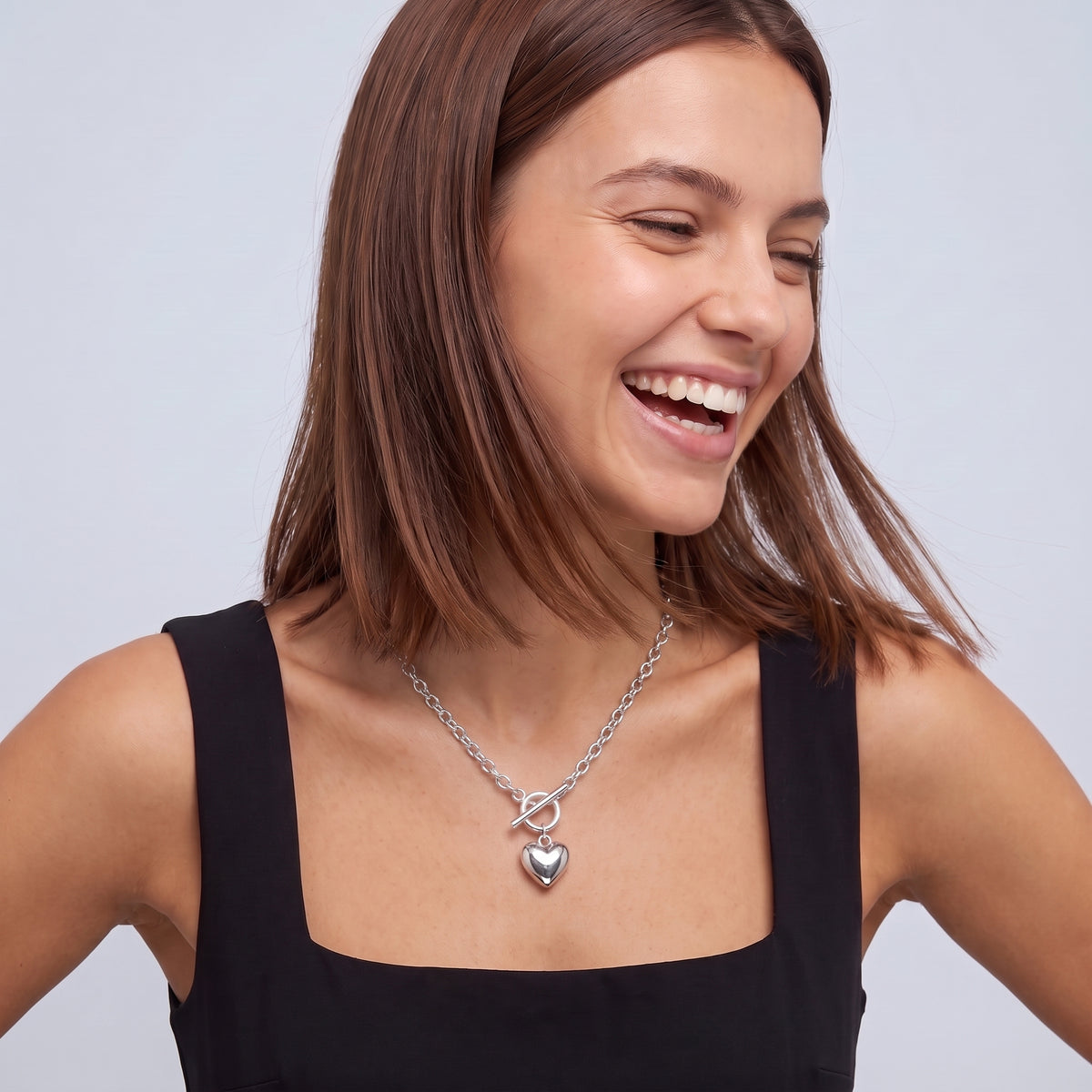 Laughing woman wearing the Bea Chunky Silver Necklace