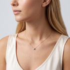 Woman in soft side light wearing the Beatrice Circle Necklace