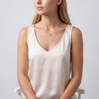 Seated woman wearing the Beatrice Circle Necklace