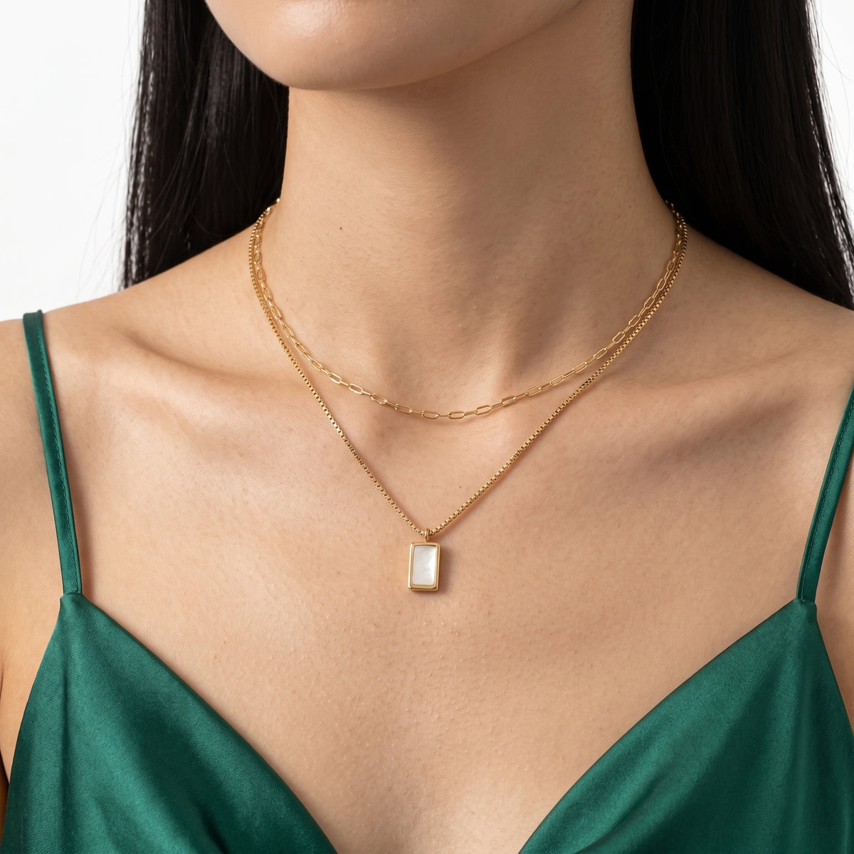 Close-up of the Lelice Bianca Layered Necklace in gold at the collarbone