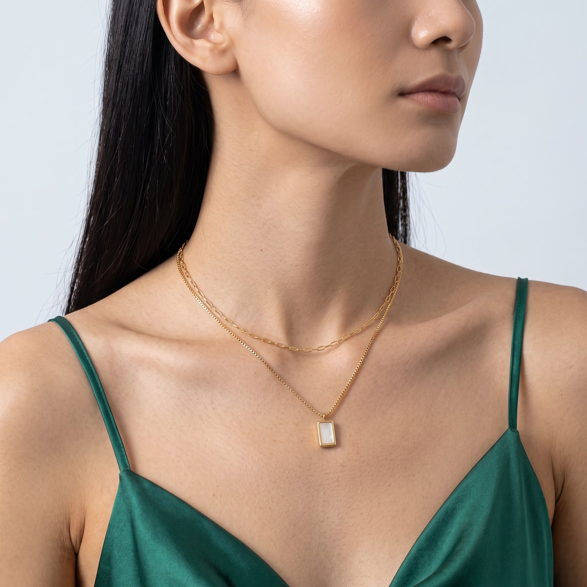 Three-quarter profile of a woman wearing the Bianca Layered Necklace