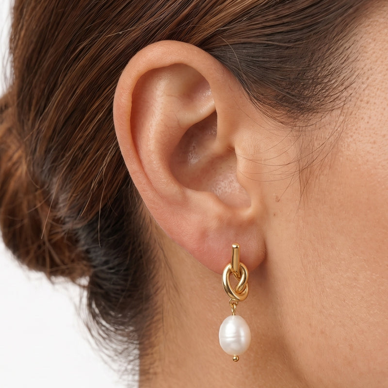 Close-up of the Lelice Brigitte Pearl Earrings in gold on the ear
