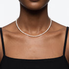 Close-up of the Lelice Camille Pearl Choker in gold at the collarbone