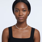 Portrait of a woman wearing the Camille Pearl Choker