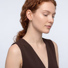 Model wearing the Lelice Celine Crystal Hoops in gold, serene chin lift
