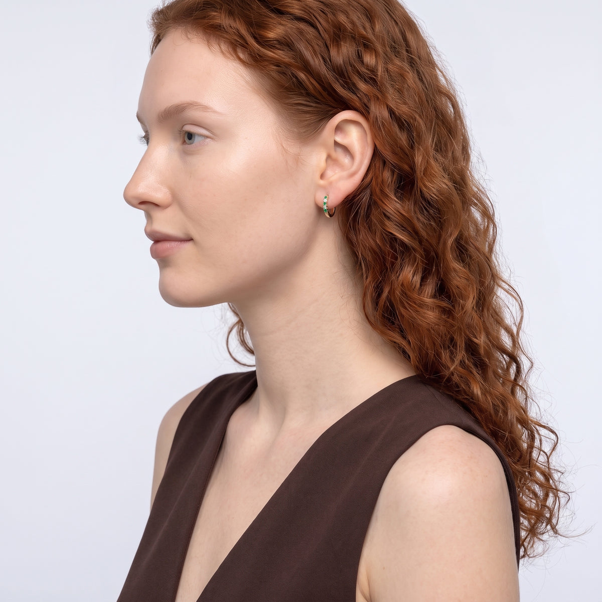 Model wearing the Lelice Celine Crystal Hoops in gold, sculpted side profile