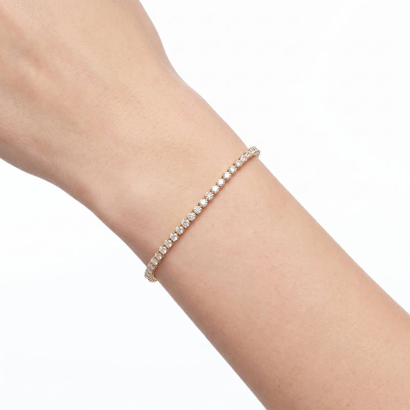 Close-up of the Lelice Charlotte Tennis Bracelet in gold on the wrist