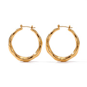 Lelice Claire Polished Hoops in gold on a white background