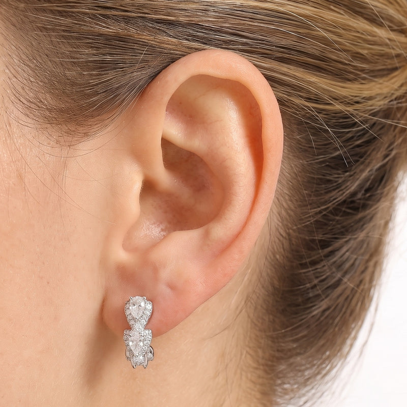 Close-up of the Lelice Clear Crystal Hoops in silver on the ear