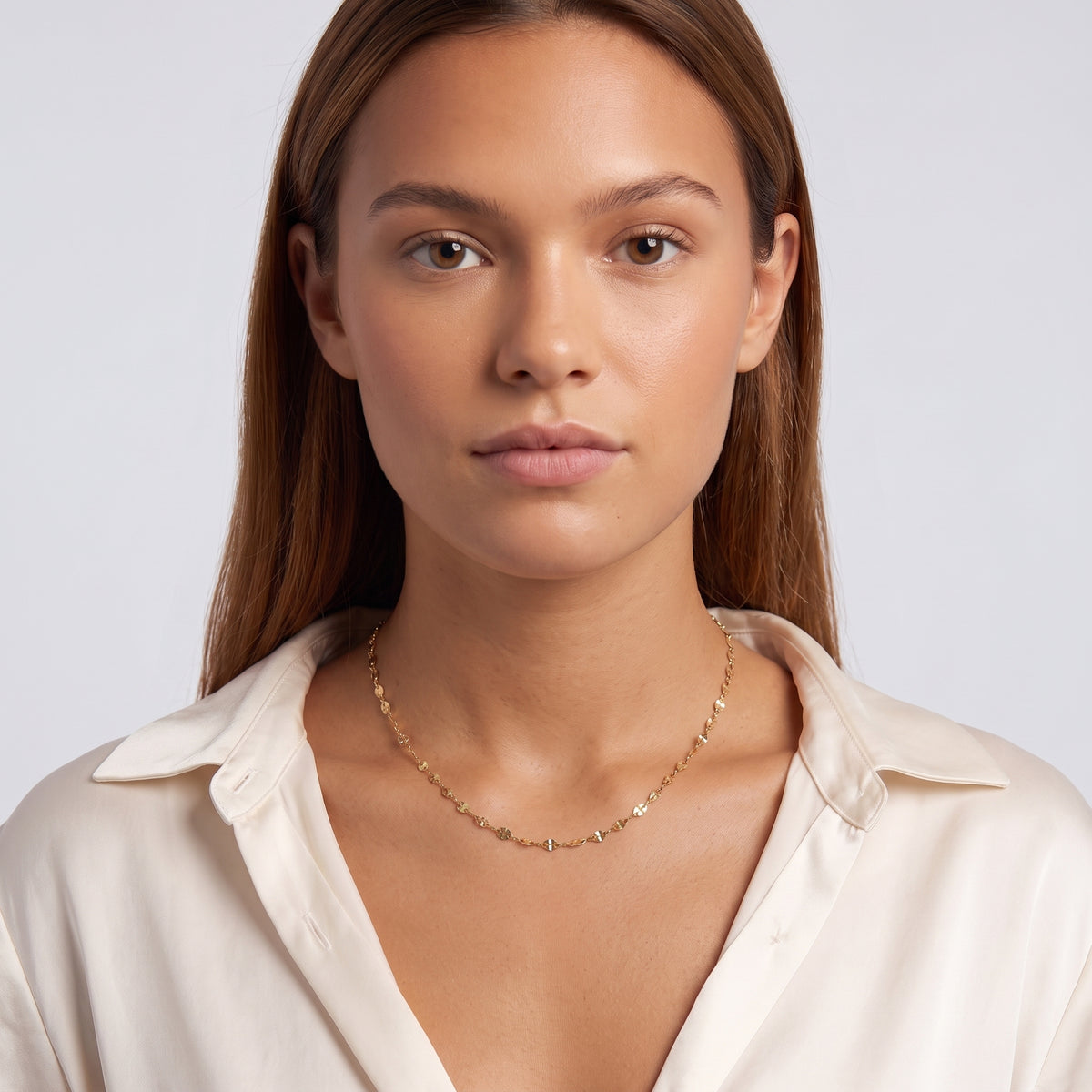 Portrait of a woman wearing the Cleo Fine Choker Necklace