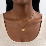 Close-up of the Lelice Coastal Tide Necklace in gold at the collarbone