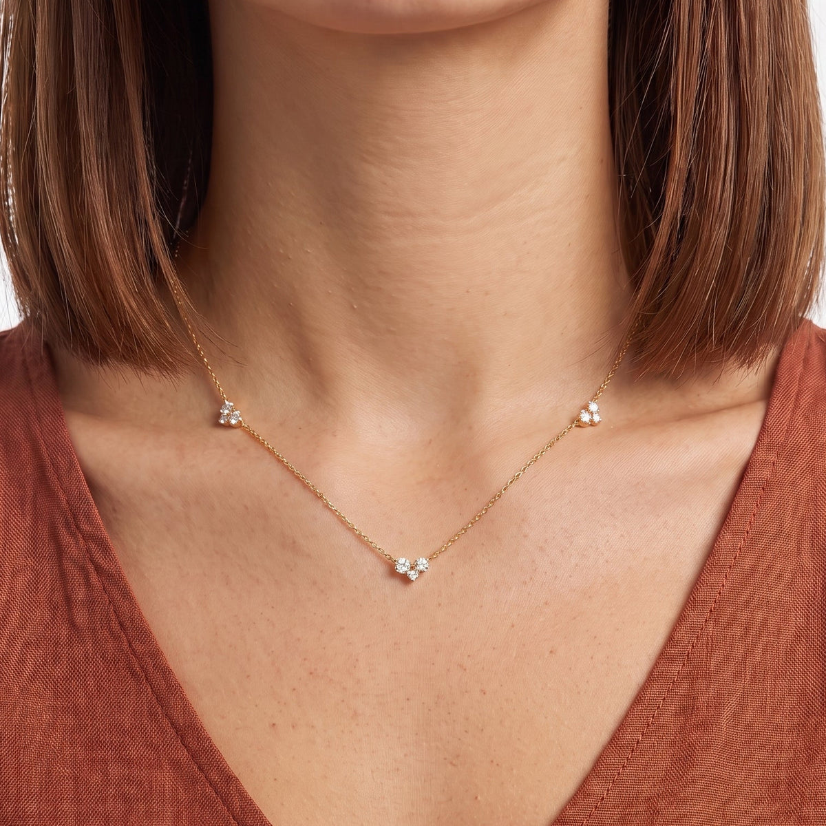 Close-up of the Lelice Constance Crystal Station Necklace in gold at the collarbone