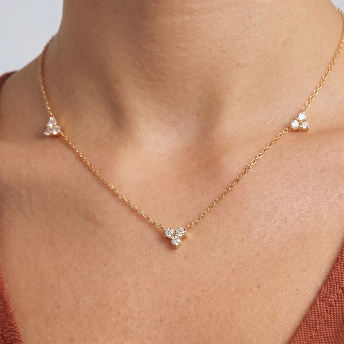 Close-up of the Constance Crystal Station Necklace resting on the skin