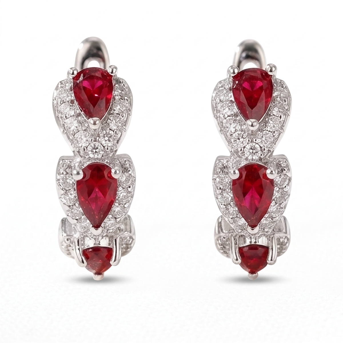 Lelice Crimson Ruby Hoops in silver on a white background