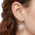 Close-up of the Lelice Crystal Rosette Silver Earrings on the ear