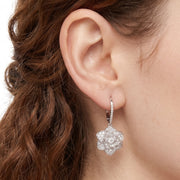 Close-up of the Lelice Crystal Rosette Silver Earrings on the ear