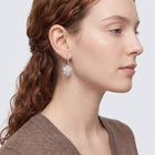 Model wearing the Lelice Crystal Rosette Silver Earrings, sculpted side profile