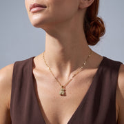 Low-angle portrait of a woman wearing the Crystal Teddy Bear Necklace