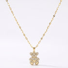 Lelice Crystal Teddy Bear Necklace in gold on a white background