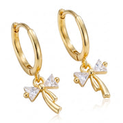 Lelice Dainty Bow Gold Hoops on a white background