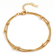 Lelice Elara Double Strand Anklet in gold on a white background