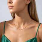 Woman in soft side light wearing the Eleni Beaded Necklace