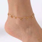 Close-up of the Lelice Elina Clover Frame Anklet in gold on a woman's ankle