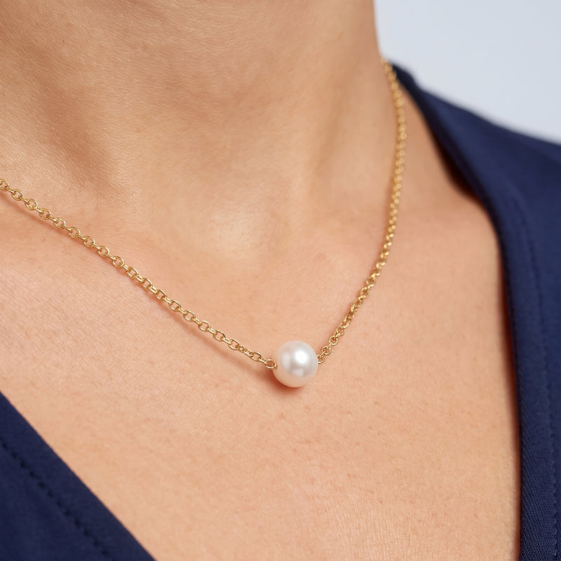 Close-up of the Elise Pearl Necklace resting on the skin