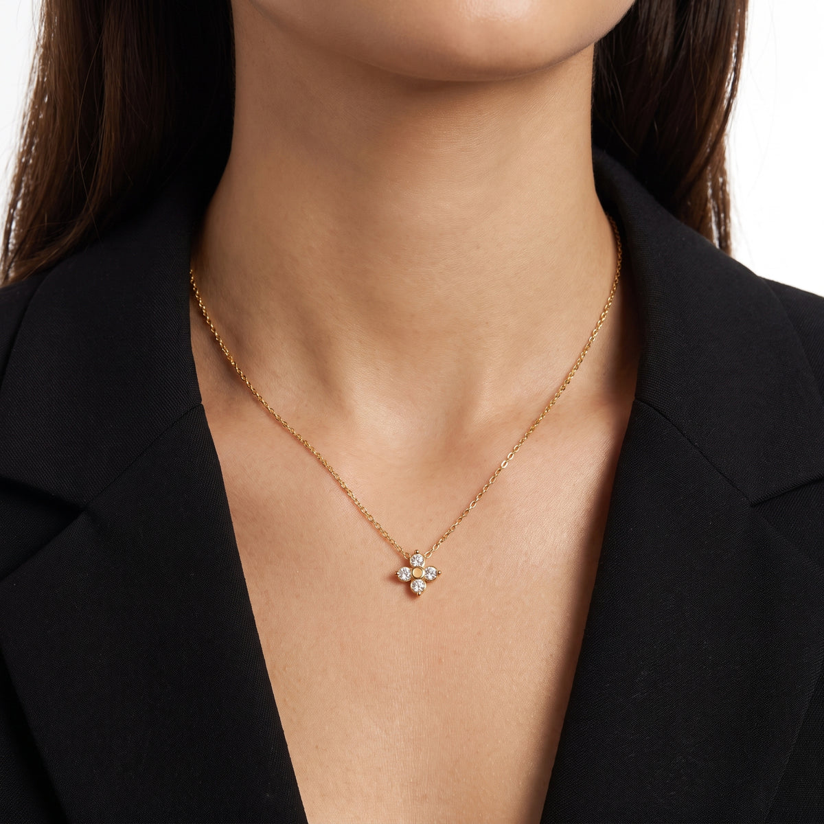Close-up of the Lelice Esme Clover Necklace in gold at the collarbone