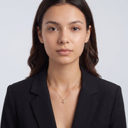 Portrait of a woman wearing the Esme Clover Necklace