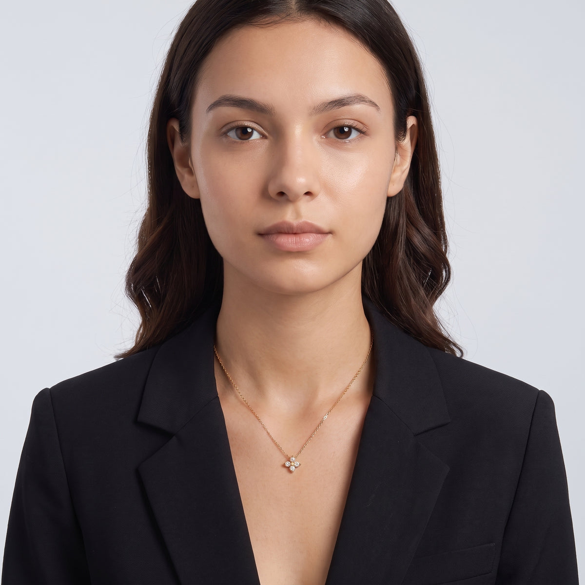 Portrait of a woman wearing the Esme Clover Necklace