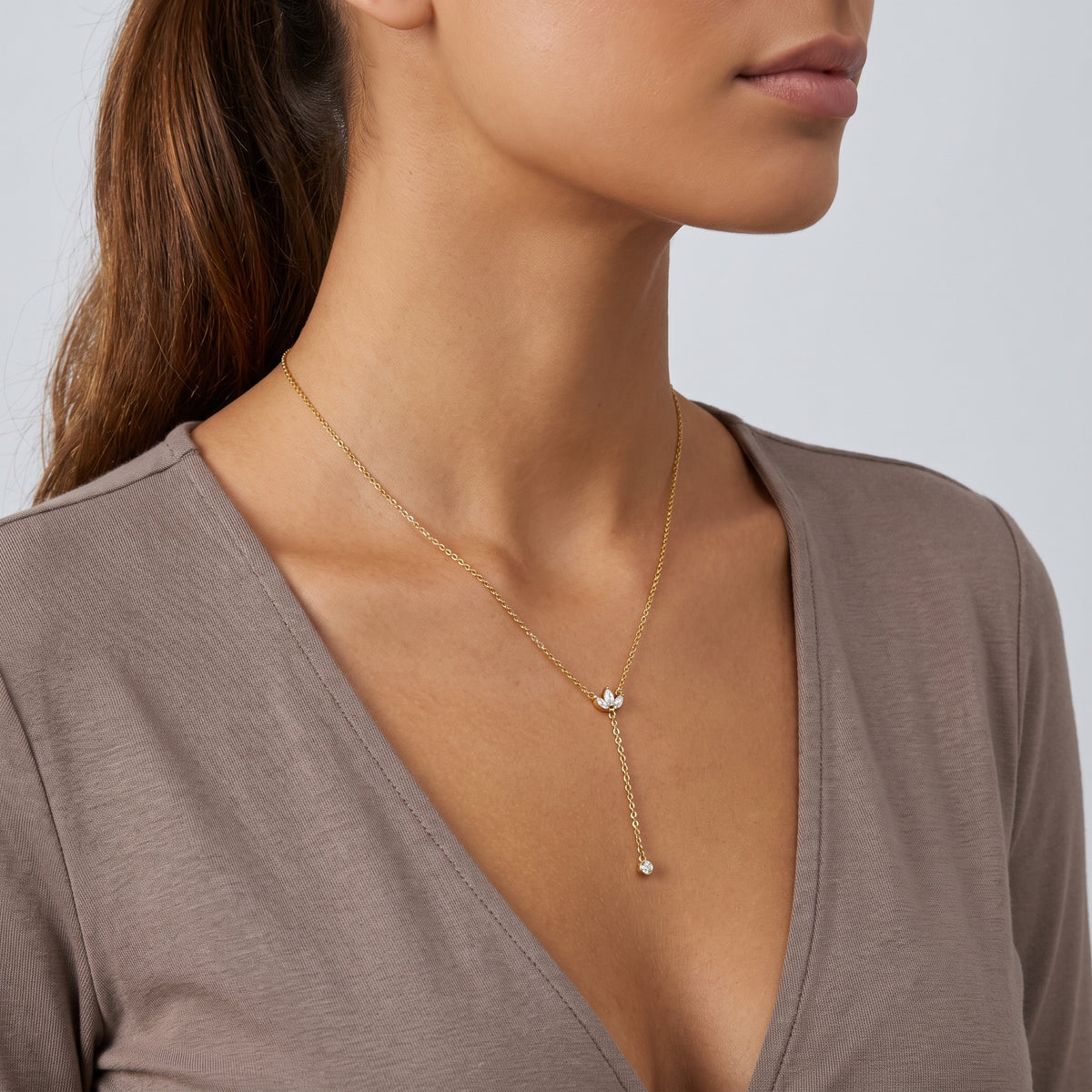 Side profile of the neckline with the Esme Lariat Necklace