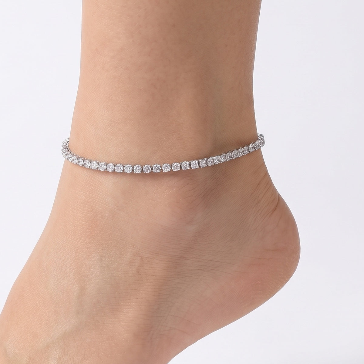 Ankle wearing Lelice silver crystal tennis anklet Eve